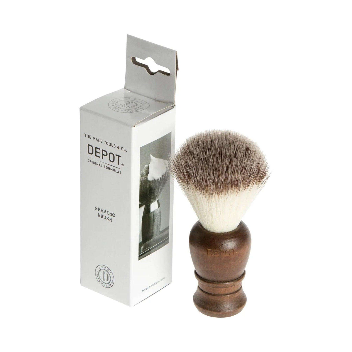 Wooden shaving brush by Depot No. 730 with synthetic bristles, used for creating a rich lather and skin exfoliation.